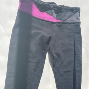 Lululemon crop leggings. Size 4. Black with pinkish purple accents.